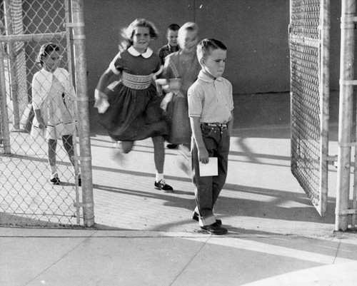 Larry Hanna, 6, mulls the lessons of first day in first grade