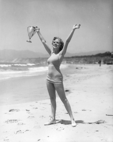 Deauville Club woman holding trophy