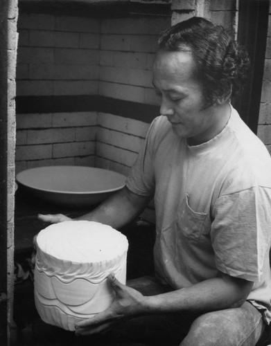 Yukio Onaga works on a pot