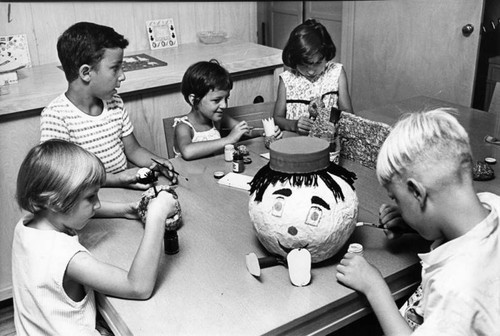 Children learn typing, puppet-making