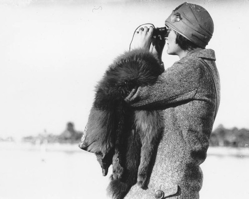 Woman with binoculars, Long Beach