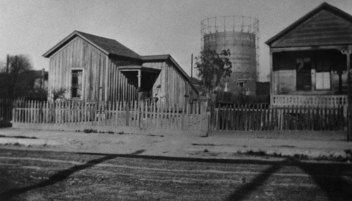 Shacks next to gas storage tanks