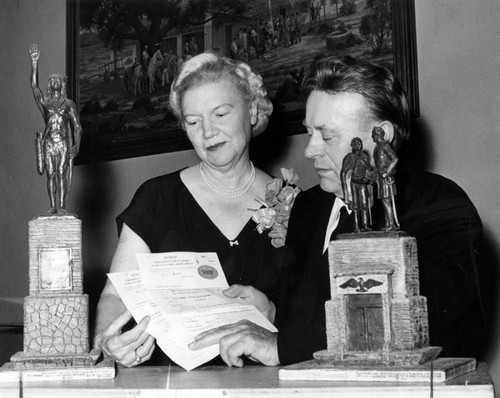 Frances Pomeroy, Henry Van Wolf hold statue copyright