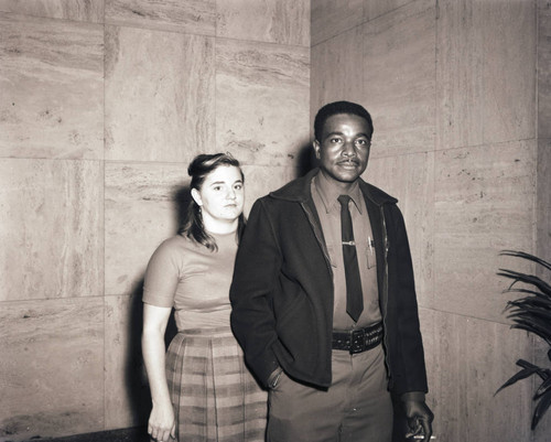 Unidentified security guard and woman