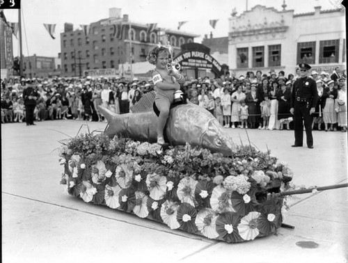 Girl on a fish parade float