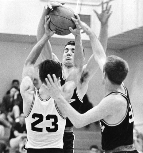 Granada Hills High's Tom Levin (No. 23) momentarily appears well guarded