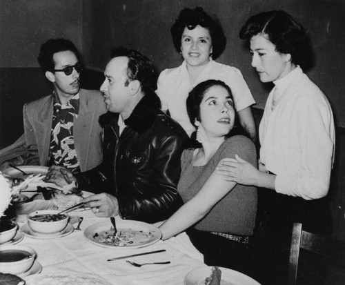 Guests at table inside of Mexican restaurant