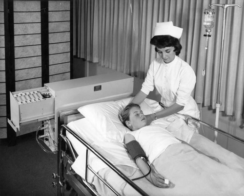 Nurse attaches competitor--'Electronic Nurse'--to patient