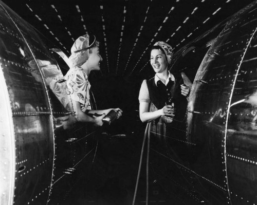 Two female aircraft workers