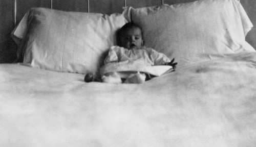 Infant on a bed