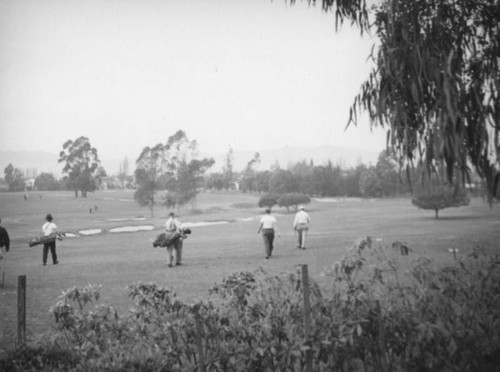 Walking toward the sand traps at the Wilshire Country Club