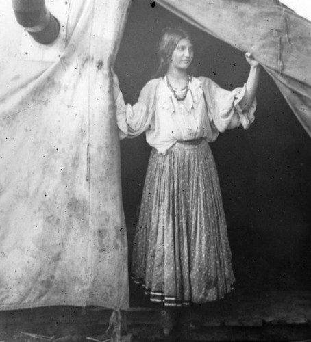 Woman at tent entrance