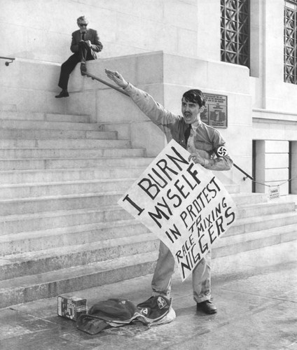 Daniel Skelly protests on steps of City Hall