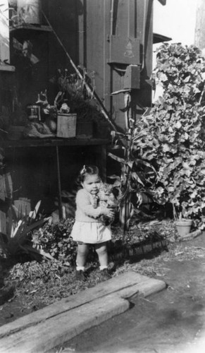 Mexican American girl with cat