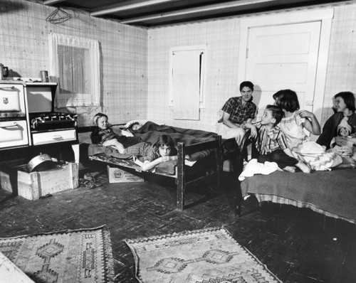 Smith family posed inside their slum apartment