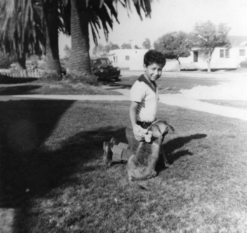 Mexican American boy with dog