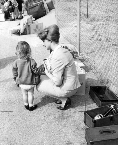 A pretty stewardess, a tired little girl