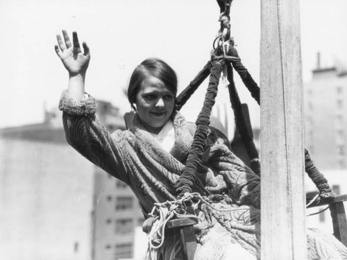 Woman on flagpole