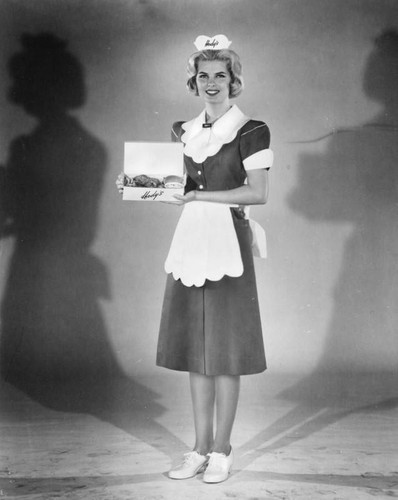 Waitress shows displays food