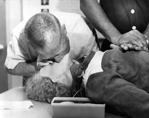 Fire officials demonstrate rescue techniques on dummy