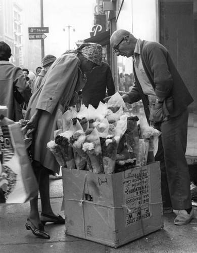 Customer and flower vendor