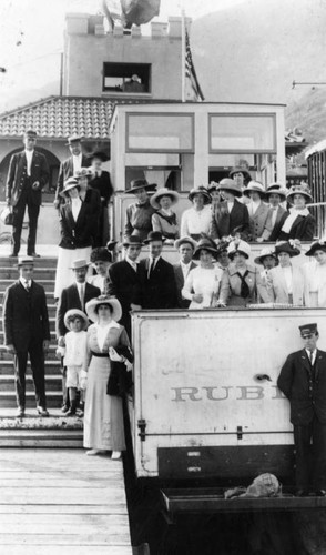 Group poses on Rubio Incline car