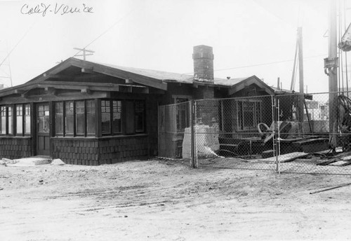 Oil derrick beside a house in Venice