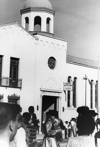 Parade passing a church