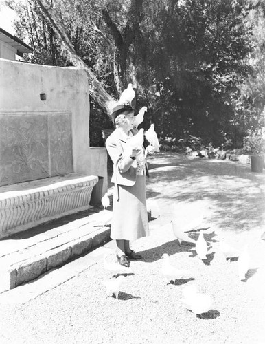 Woman with pigeons, Mission San Juan Capistrano