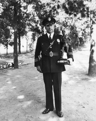 James E. Davis holding Sobel Trophy