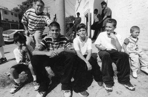 Boys sitting outside of market, Echo Park