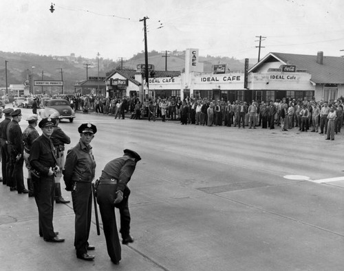 Officers stand between two battle lines