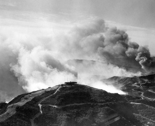 Flames hover on Valley brink