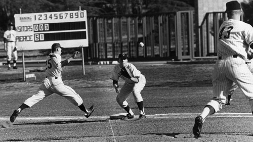 Pickoff play almost catches Trojan Doug Galbrielson off first base