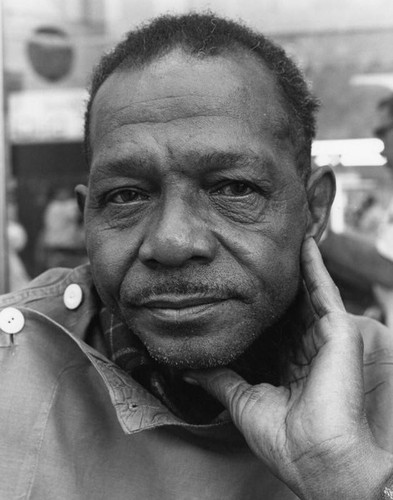 A shoeshiner at his stand, a closeup