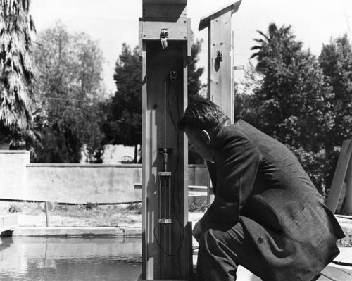 Checking rain gauge