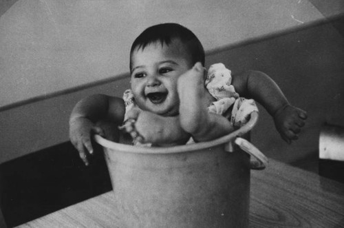 Iranian child in bucket