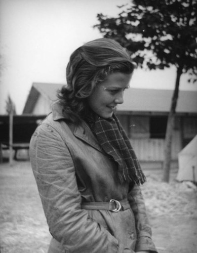 Woman by barn at Los Angeles County Fair