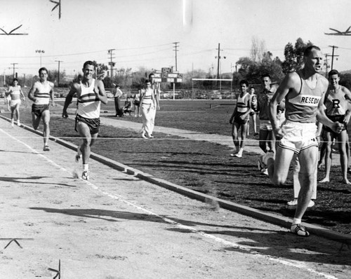 Fred Findlay shows way to tape for Reseda High in quarter mile