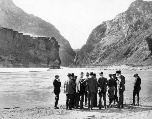 Engineers and officials view dam site