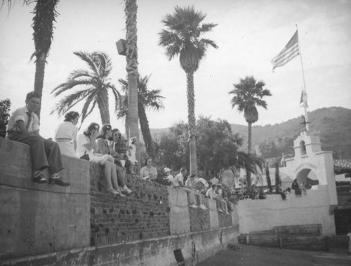 Sitting on a wall near the steamer entrance, Avalon