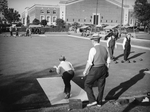 Lawn bowling in Exposition Park by the Armory Building