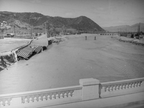 L.A. River flooding, collapsed fence from Hyperion bridge