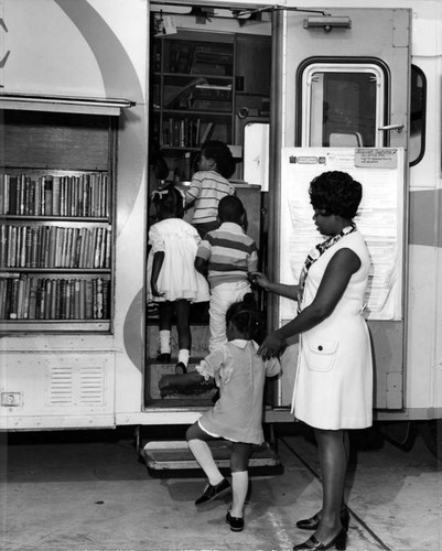 Eager young readers file into an LAPL Bookmobile