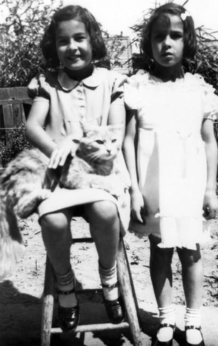 Sisters with a cat