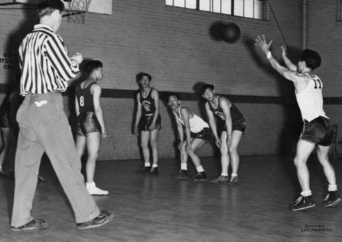 Boys playing basketball