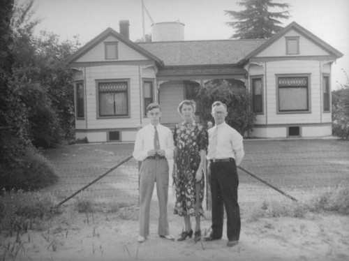 Family in front of a house