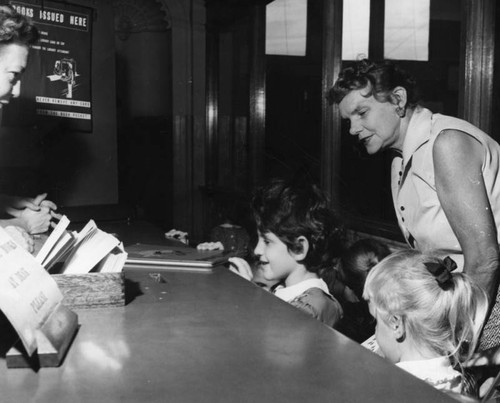 Checking out books, Cahuenga Branch Library