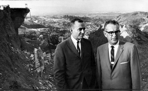 Gill, left, and Blanchard inspect Alginet Dr. slide area in Encino