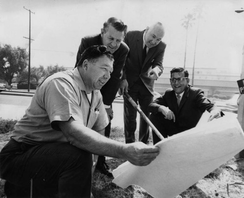Officials look over blueprints for UAW Local 645 building — Calisphere